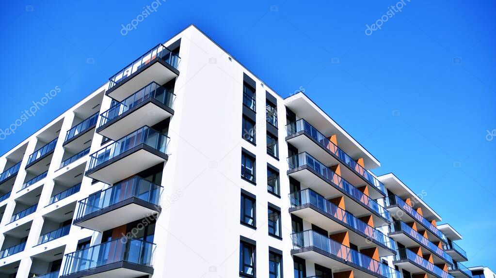 Condominium and apartment building with  symmetrical modern architecture in the city downtown. Velvia graphic filter.