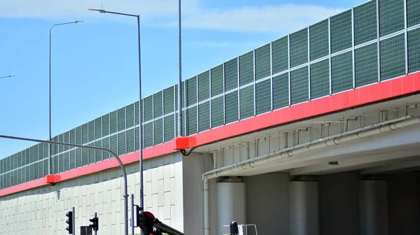 Safety barriers on the highway. Anodized safety steel barrier on freeway bridge.