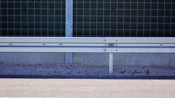 Safety barriers on the highway. Anodized safety steel barrier on freeway bridge.