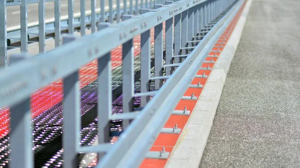 Safety barriers on the highway. Anodized safety steel barrier on freeway bridge.