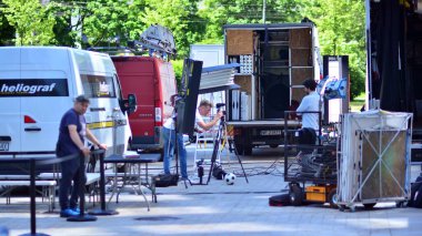 Warsaw, Poland. 14 June 2021. Busy outdoor filming production crew team. Work on an advertising film.