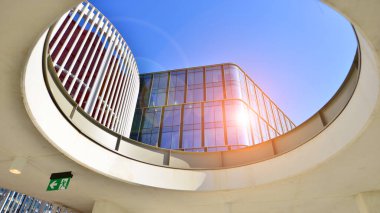 A modern corporate hub in the city center. The structure features a glass and concrete walls, showcasing contemporary architecture. Modern luxury office building.