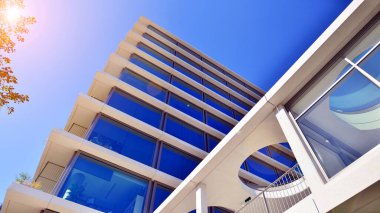 A modern corporate hub in the city center. The structure features a glass and concrete walls, showcasing contemporary architecture. Modern luxury office building.
