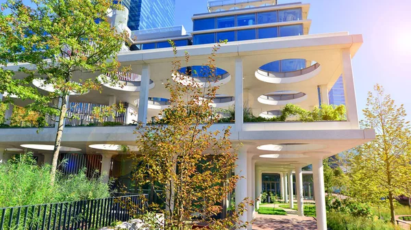 Modern luxury office building.The structure features a glass and concrete walls, showcasing contemporary architecture. The green surroundings of office buildings. Trees and shrubs in the city.