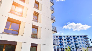 New modern block of flat, condo architecture. Residential apartment flat, luxury house complex. City real estate property.