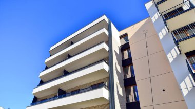 New modern block of flat, condo architecture. Residential apartment flat, luxury house complex. City real estate property.