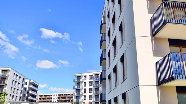 New modern block of flat, condo architecture. Residential apartment flat, luxury house complex. City real estate property.