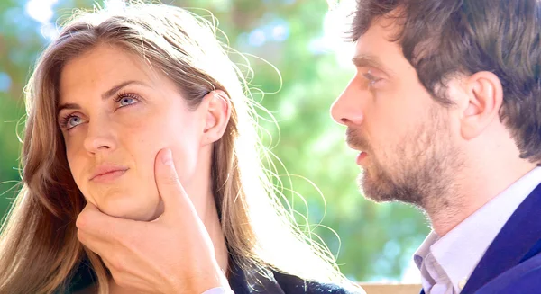 Angry business couple fighting man holding face of woman closeup — Stock Photo, Image