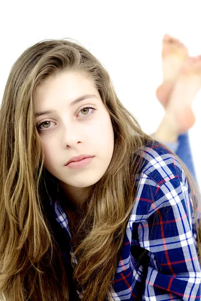 Serious teenager with long hair and green eyes looking — Stock Photo, Image