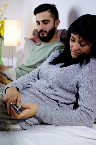 Woman hiding text message from boyfriend — Stock Photo, Image