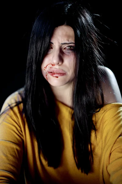 Beautiful woman bleeding after being hit — Stock Photo, Image