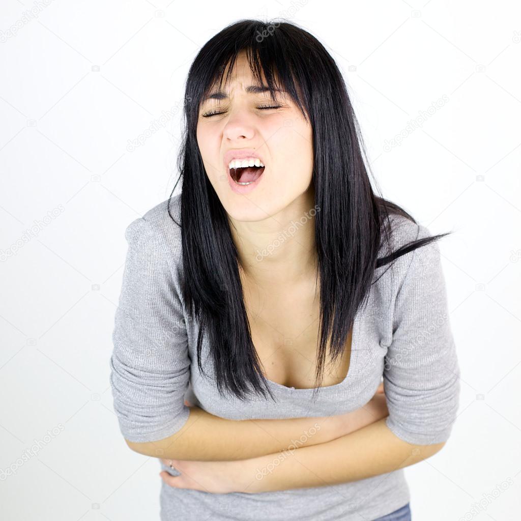 Young woman shouting for menstruation stomach cramp