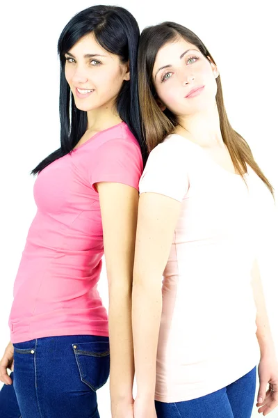 Happy girlfriends smiling holding hands — Stock Photo, Image