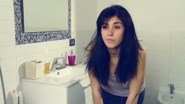 Beautiful young woman in bathroom — Stock Video