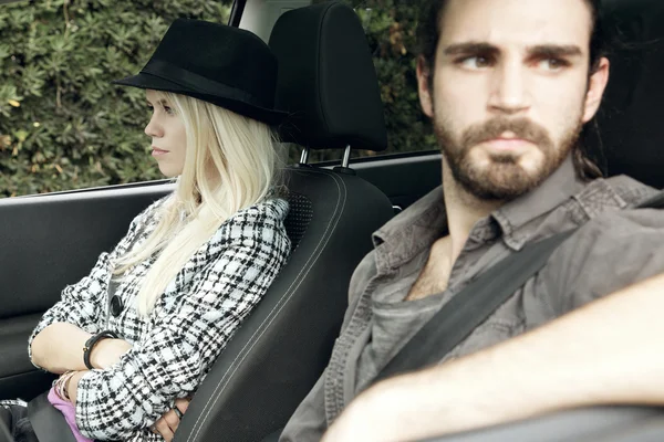 Woman mad at man in car after a fight — Stock Photo, Image