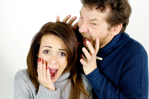 Woman scared of angry husband yelling at her isolated — Stock Photo, Image