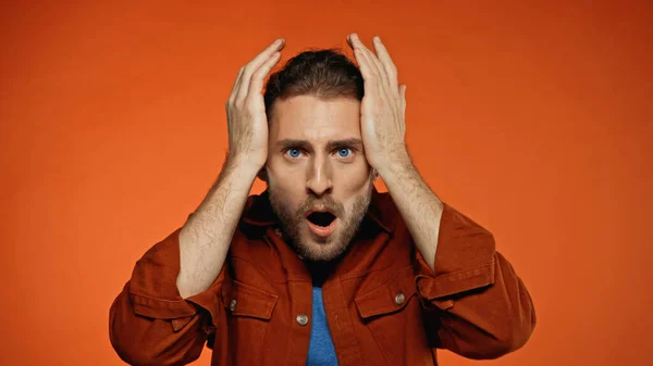 Shocked Young Man Looking Camera Orange — Stock Photo, Image