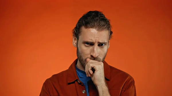 Young Pensive Man Thinking Looking Camera Orange Background — Stock Photo, Image