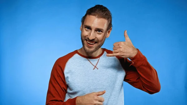 Positive Young Man Showing Call Gesture While Looking Camera Blue — Stock Photo, Image