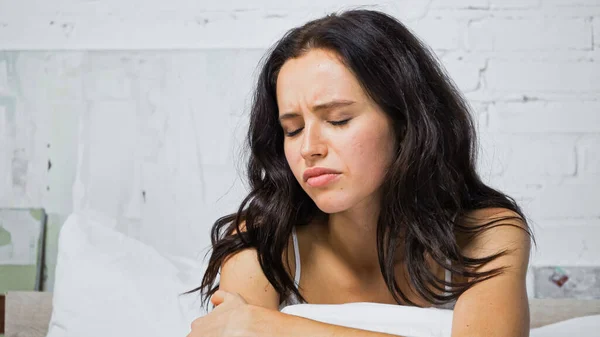Offended Brunette Woman Sitting Bedroom Closed Eyes — Stock Photo, Image
