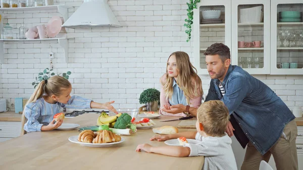 Parents Children Standing Croissants Bananas Kitchen — Stock Photo, Image