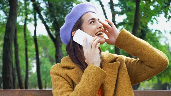 Excited Woman Touching Face Looking Away While Calling Mobile Phone — Stock Photo, Image