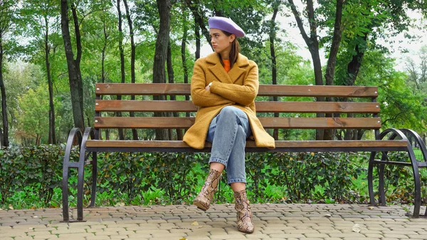 Trendy Displeased Woman Looking Away While Sitting Crossed Arms Bench — Stock Photo, Image