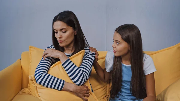 Daughter Calming Upset Mother Holding Pillow Living Room — Stock Photo, Image