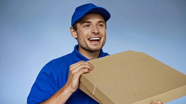 Excited Delivery Man Looking Away While Holding Pizza Boxes Isolated — Stock Photo, Image