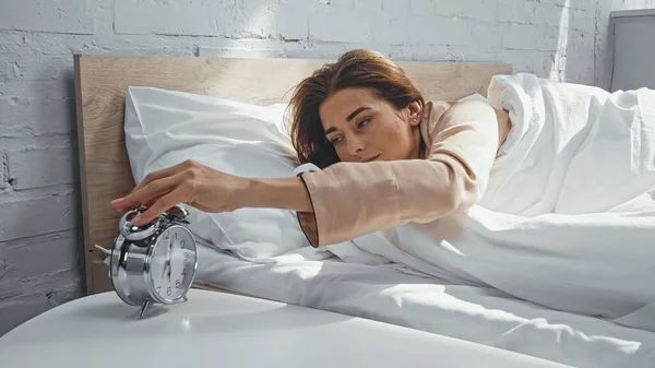 Young Woman Turning Alarm Clock Morning — Stock Photo, Image