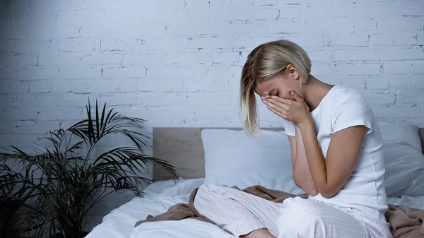 Diseased Woman Obscuring Face Hands While Sneezing Bedroom — Stock Photo, Image