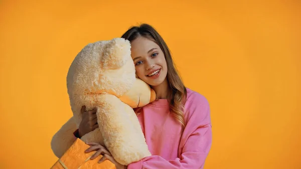 Happy Teenage Girl Pink Sweatshirt Holding Teddy Bear Isolated Yellow — Stock Photo, Image