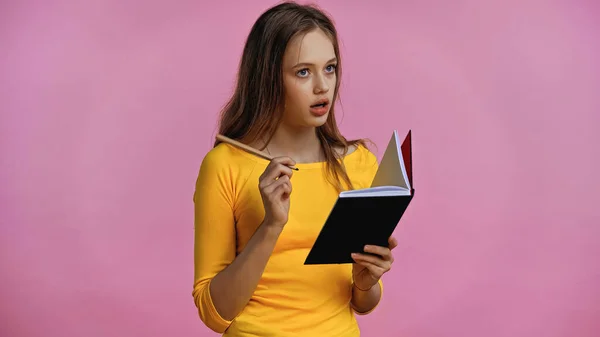 Pensive Teenage Girl Holding Notebook Pen Isolated Pink — Stock Photo, Image