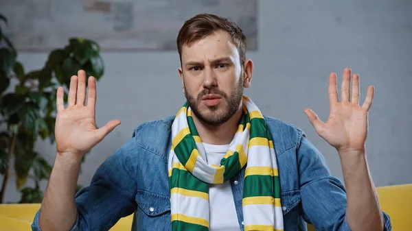 Bearded Man Scarf Raised Hands Looking Camera — Stock Photo, Image