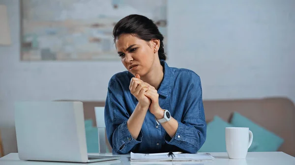 Displeased Freelancer Sitting Clenched Hands Looking Laptop — Stock Photo, Image