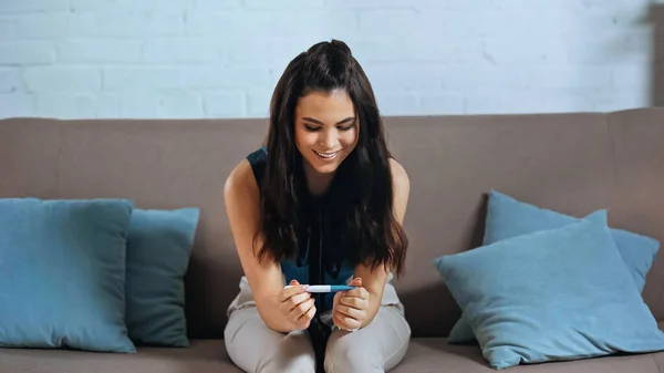 Happy Young Woman Holding Pregnancy Test Home — Stock Photo, Image