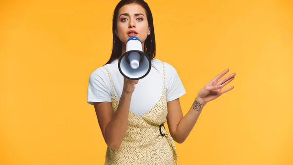 Young Woman Talking Loudspeaker Pointing Hand Isolated Yellow — Stock Photo, Image