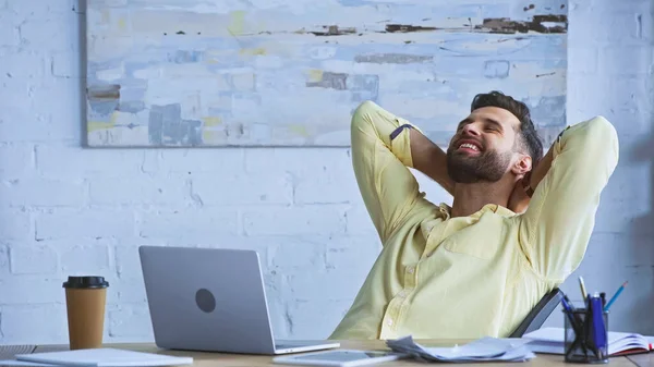 Joyful Businessman Sitting Workplace Closed Eyes Hands Head — Stock Photo, Image