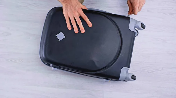 Top View Man Zipping Black Luggage — Stock Photo, Image