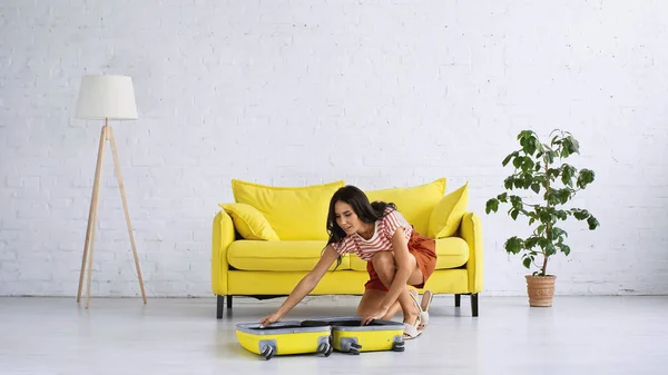 Pleased Brunette Woman Looking Empty Suitcase Living Room — Stock Photo, Image