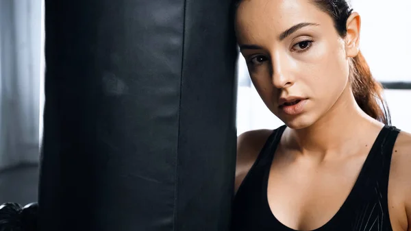 Tired Young Sportswoman Leaning Punching Bag Gym — Stock Photo, Image