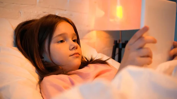 Preadolescent Girl Using Digital Tablet Blurred Blanket Bed — Stock Photo, Image