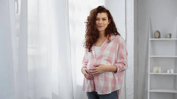 Pregnant Curly Woman Looking Camera White Curtain — Stock Photo, Image