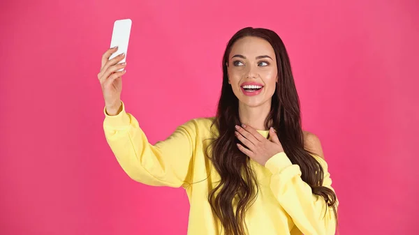 Smiling Young Adult Woman Taking Selfie Cellphone Holding Hand Chest — Stockfoto