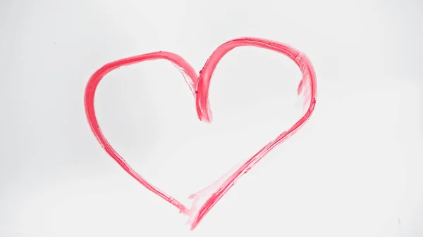 Top view of drawn pink heart with lipstick on white — Stock Photo