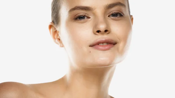 Young woman with perfect skin looking at camera and smiling isolated on white — Stock Photo