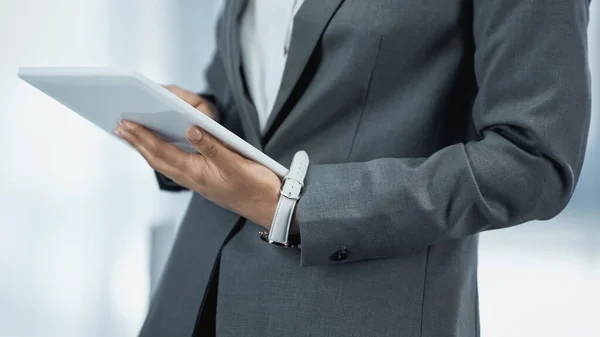 Cropped view of african american businesswoman using digital tablet — Stock Photo