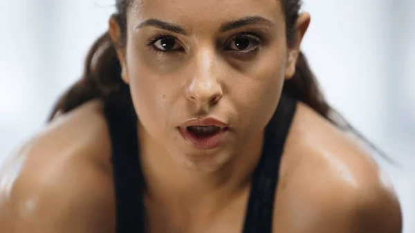 Close up of sweaty sportswoman working out in gym — Stock Photo