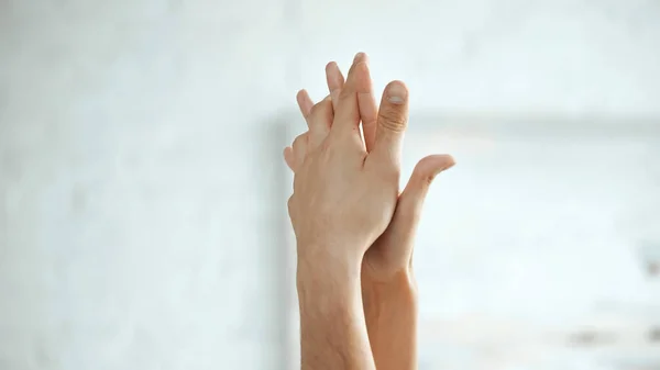 Partial view of sensual couple holding hands — Stock Photo