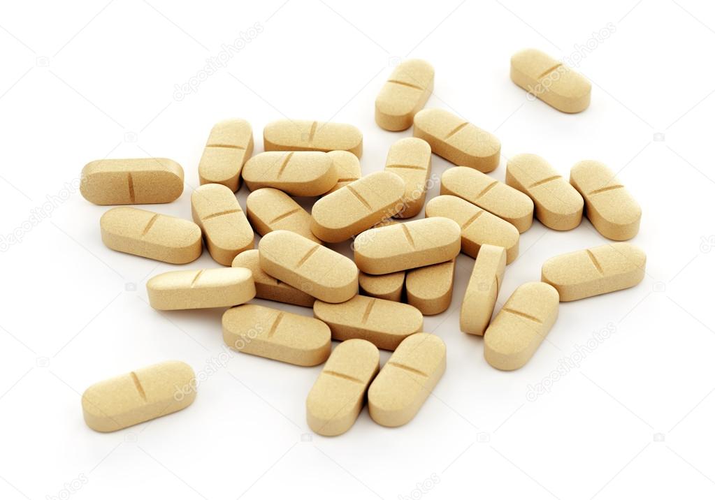 Yellow pills on white